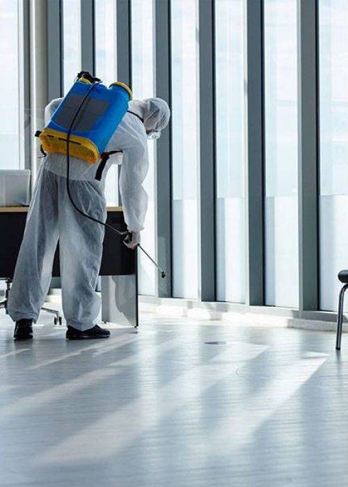 Cleaning and Disinfection at office amid the coronavirus epidemic Professional teams for disinfection efforts Infection prevention and control of epidemic Protective suit and mask.